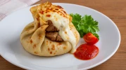 Manisa Bohça Kebabı: Kuzu Etinin Kreple Buluştuğu Bu Saray Lezzetini Denemelisiniz!
