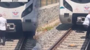 Raylara düşen kediyi kurtarmak için treni durdurdu, raylara indi