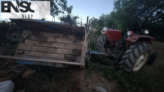 Devrilen traktörün altında kalan kadın ağır yaralandı