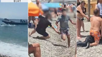 Botlardan atlayan göçmenleri plajda kovaladılar