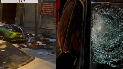 Evdeki eşyaları pencereden attı: 2 araca zarar verdi