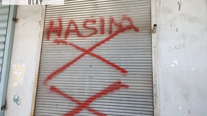 Dükkanının kepengine 'hasım' yazan kişiyi tabancayla bacağından vurdu