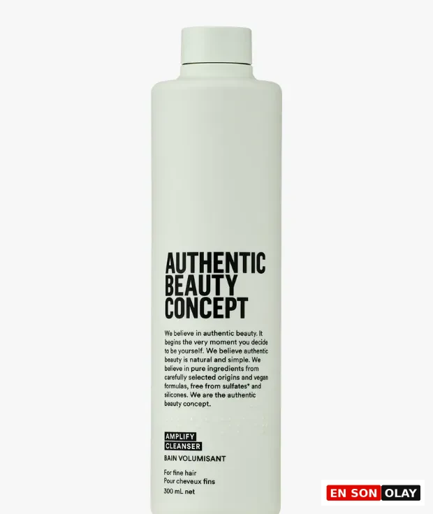 Dikdörtgen formda, soluk yeşil renkli, üzerinde siyah harflerle AUTHENTIC BEAUTY CONCEPT yazan ve hacim veren şampuan olarak etiketlenmiş 300 ml'lik şişenin ön yüzü, sade ve modern tasarımıyla dikkat çekiyor.