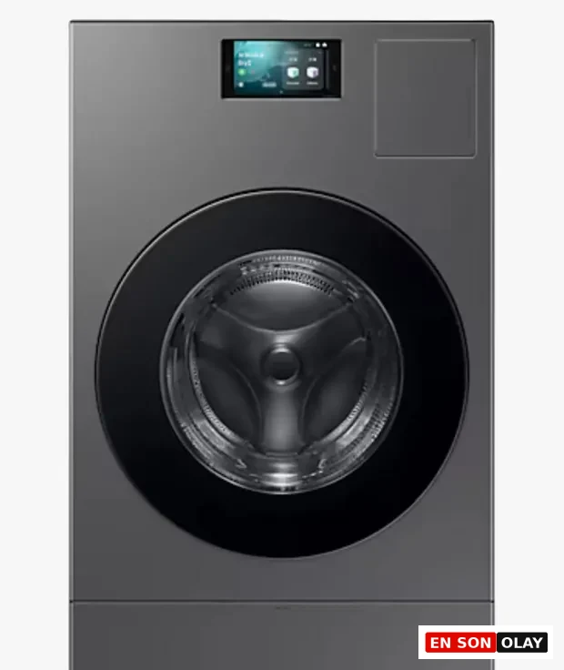 Antrasit gri renkli Samsung marka önden yüklemeli çamaşır makinesi; geniş siyah cam kapak, üst bölümde dokunmatik ekranlı akıllı kontrol paneli ve modern premium tasarım.